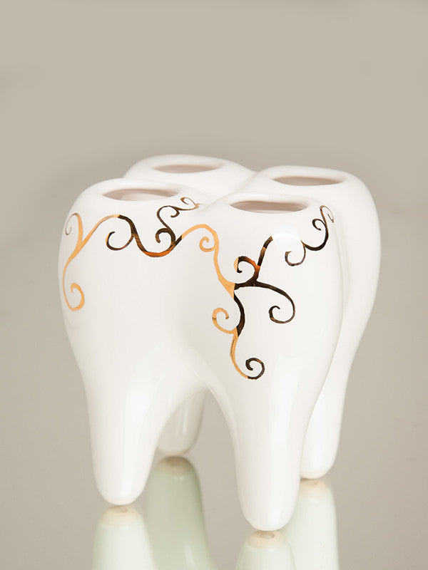 Keramikinis dantų stovas šepetėliams. Baltas su aukso ornamentais.